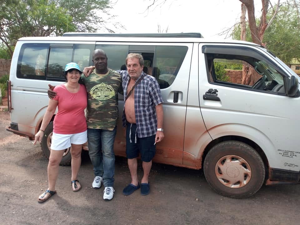 Safari guests and vehicle on a Jimmy Holiday safari